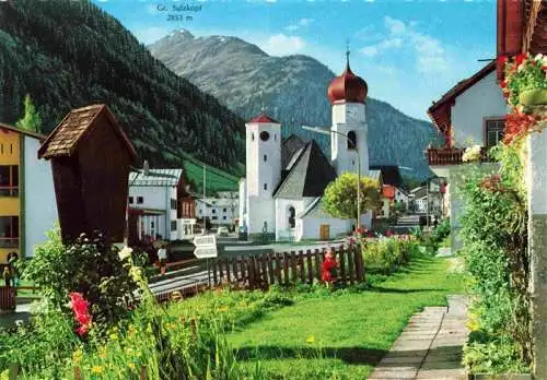 AK / Ansichtskarte  St_Anton_Arlberg_Tirol_AT Ortspartie mit Kirche und Gr Sulzkopf