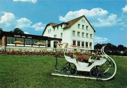 AK / Ansichtskarte  Ascheberg_Holstein Cafe Restaurant Hotel am See Geschmueckter Schlitten