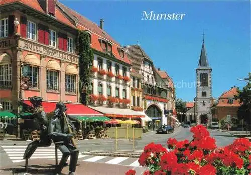 AK / Ansichtskarte  Muenster  Elsass Munster 68 Alsace Haut-Rhin Rue de la République Sculpture Hôtel Restaurant Cigogne