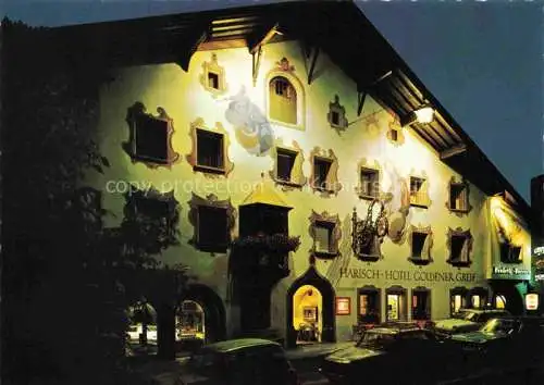 AK / Ansichtskarte  Kitzbuehel Tirol AT Hotel Goldener Greif unter Beleuchtung Nachtaufnahme