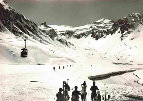 AK / Ansichtskarte Tignes_Albertville_73_Savoie Station la plus haute d Europe Skieurs au retour des Campanules 