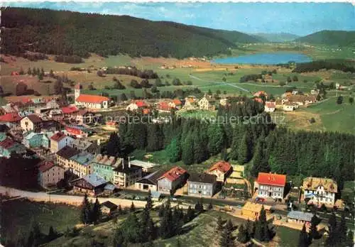 AK / Ansichtskarte Les_Rousses_Saint Claude_39_Jura Vue generale aerienne sur le village et le lac 