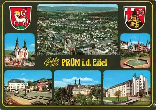 AK / Ansichtskarte Pruem Eifel Rheinland-Pfalz Kirche Fliegeraufnahme Brunnen Marktplatz Hotel