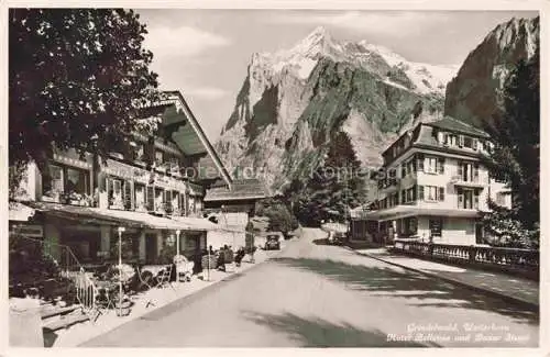 AK / Ansichtskarte Grindelwald BE Hotel Bellevue und Bazar Steuri Blick gegen Wetterhorn Berner Alpen