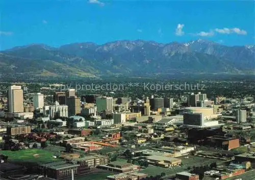 AK / Ansichtskarte Salt Lake City Utah USA Aerial view of downtown Wasatch Mountain Range in the background