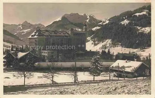AK / Ansichtskarte Gstaad Saanen BE Grand Hotel Royal und Winter Palace Winterpanorama Berner Alpen