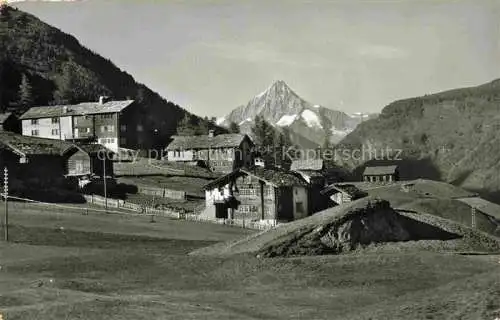 AK / Ansichtskarte Saas-Fee VISP VS Haeusergruppe in der Wildi mit Bietschhorn Walliser Alpen