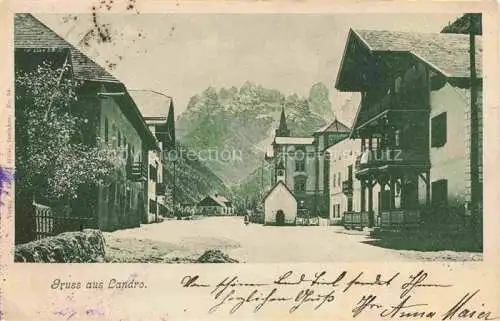 AK / Ansichtskarte Landro Innichen Hauptstrasse Blick zur Kirche Dolomiten