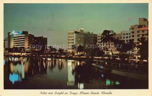 AK / Ansichtskarte Miami Beach Florida USA Haeuserpartie am Wasser Nachtaufnahme