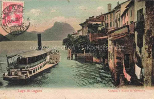 AK / Ansichtskarte Gandria Lago di Lugano Haeuserpartie am See Fahrgastschiff Blick gegen Monte Salvatore