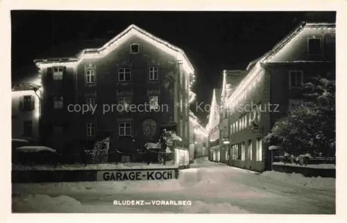 AK / Ansichtskarte Bludenz Vorarlberg AT Gaststaette Restaurant Garage-Koch im Winter Nachtaufnahme