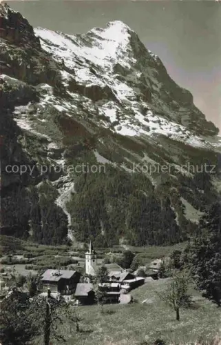 AK / Ansichtskarte Grindelwald BE Schulhaus und Kirche mit Eiger