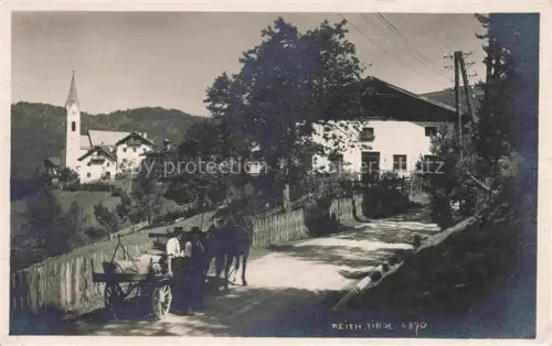 AK / Ansichtskarte Reith Alpbachtal Tirol AT Teilansicht mit Kirche Pferdewagen