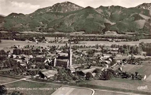 AK / Ansichtskarte uebersee Uebersee Chiemsee Bayern Fliegeraufnahme mit Hochfelln