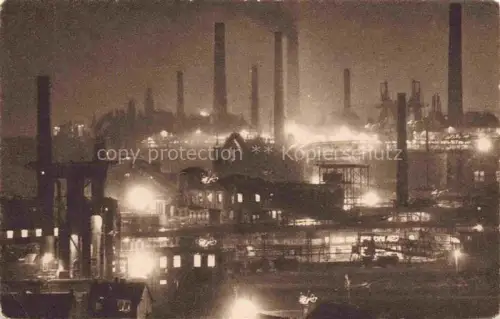 AK / Ansichtskarte Voelklingen Saarbruecken Saarland Eisenwerke bei Nacht