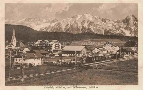 AK / Ansichtskarte Seefeld Tirol AT Ortsansicht mit Kirche Blick gegen Wettersteingebirge