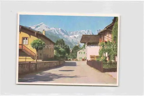 AK / Ansichtskarte GARMISCH-PARTENKIRCHEN Bayern Ortspartie mit Zugspitzblick