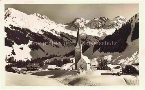 AK / Ansichtskarte Mittelberg Vorarlberg AT Ansicht mit Kirche Winterlandschaft Schafalpkoepf Hammerspitze 
