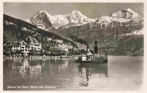 AK / Ansichtskarte Gunten Thunersee BE Blick ueber den See gegen Eiger Moench und Jungfrau Berner Alpen Faehre