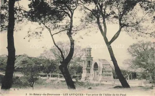 AK / Ansichtskarte St Remy-de-Provence ARLES 13 Les Antiques vue prise de l'Allée de St. Paul