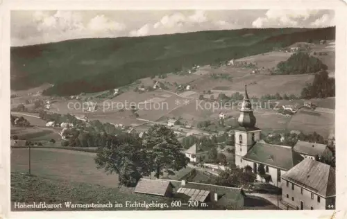 AK / Ansichtskarte Warmensteinach Teilansicht mit Kirche Hoehenluftkurort Fichtelgebirge