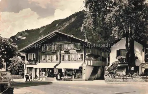 AK / Ansichtskarte Meiringen Oberhasli BE Motiv Ortszentrum Hotel Ladengeschaefte
