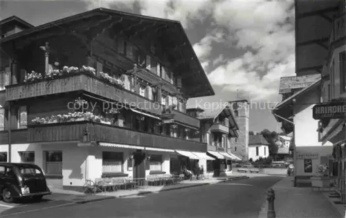 AK / Ansichtskarte Adelboden Frutigen BE Dorfstrasse mit Hotel Baeren