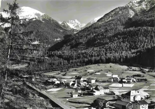 AK / Ansichtskarte Valchava Inn GR Panorama Blick gegen Piz Minschuns und Piz Costainas