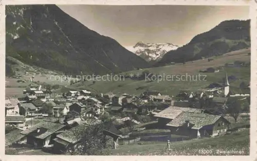 AK / Ansichtskarte Zweisimmen BE Ortsansicht mit Kirche Berner Alpen