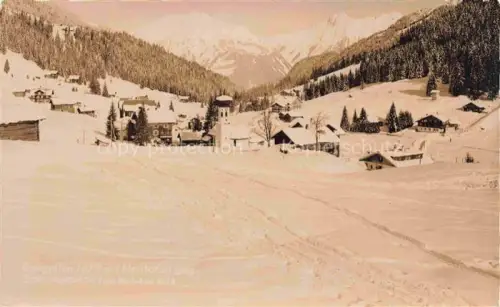AK / Ansichtskarte Gargellen Montafon Vorarlberg AT Zamangspitze Winterlandschaft Kirchturm Dorf Berge Skigebiet