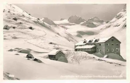 AK / Ansichtskarte Galtuer Landeck Tirol AT Jamtalhuette mit Jamspitze Dreilaenderspitze Silvretta Winterpanorama