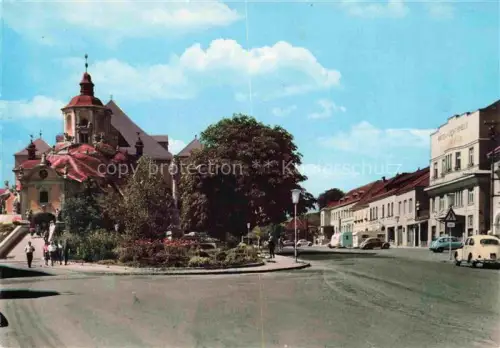 AK / Ansichtskarte Eisenstadt Burgenland AT Haydn-Gedaechtniskirche Stadtpfarrkirche Stadtplatz Mariensaeule Geschaefte Autos Barockkirche