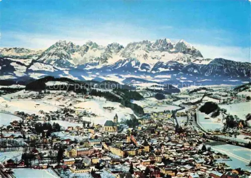 AK / Ansichtskarte Kitzbuehel Tirol AT Wilder-Kaiser Winterpanorama Kirchturm Tal Skipiste Bergkette