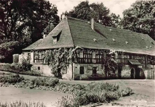 AK / Ansichtskarte Meuselwitz Thueringen Stadtmuehle Fachwerkhaus Muehlengebaeude Bach Baeume Efeu