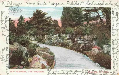 AK / Ansichtskarte Kew London Kew-Gardens Rockery Steingarten Weg Palmlilien Kiefern Zierpflanzen Botanischer-Garten