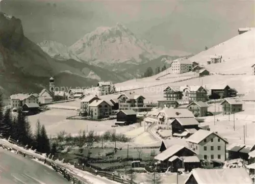 AK / Ansichtskarte San Cassiano Badia St Kassian IT San-Cassiano Hotel-Cunturines Val-Badia Dolomiten Kirchturm Winterlandschaft Schnee Bergdorf Skigebiet
