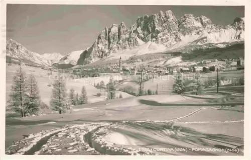 AK / Ansichtskarte Cortina d Ampezzo Veneto IT Pomagagnon Winterlandschaft Schnee Dolomiten Kirche Skigebiet Bergdorf Nadelwaelder