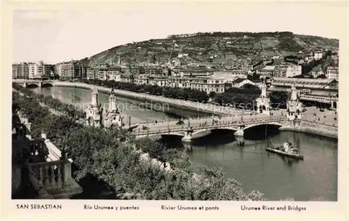 AK / Ansichtskarte Pasajes de San Juan Pasaia San Sebastian ES Río-Urumea Bruecken Puente-de-María-Cristina Stadtpanorama Huegel Skulpturen Uferpromenade