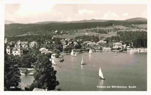 AK / Ansichtskarte Velden  Woerthersee AT Woerthersee See Bucht Segelboote Villen Ort Wald Huegel