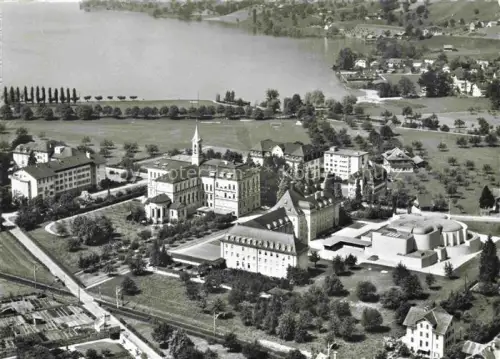 AK / Ansichtskarte Sarnen Obwalden OW Benediktiner Kollegium mit St Martinskirche Fliegeraufnahme