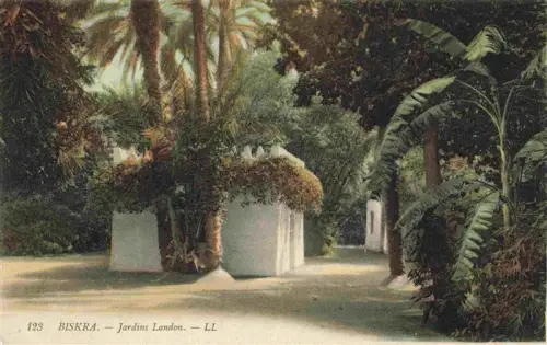 AK / Ansichtskarte Biskra Algerie Jardins-Landon Palmen Tropische-Vegetation Weisse-Mauer Weg Park Bananenbaeume
