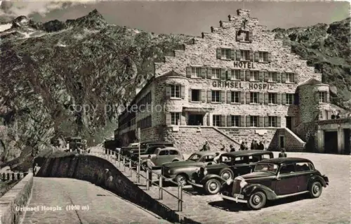AK / Ansichtskarte Grimsel Hospiz Hotel-Grimsel-Hospiz Parkplatz Autos Berghotel Felswand Hochgebirge