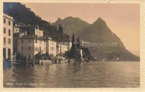 AK / Ansichtskarte Oria  Lago di Lugano TI Lago-di-Lugano Ufer Haeuser Zypressen Berge Monte-San-Salvatore
