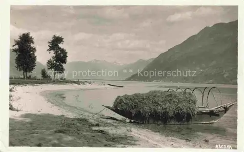AK / Ansichtskarte Ascona Lago Maggiore TI Lago-Maggiore Heufloesse Ufer Baeume Berge Sandstrand