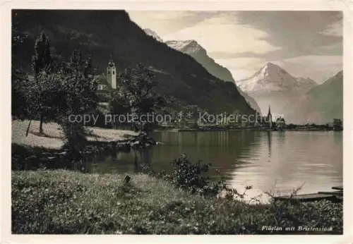 AK / Ansichtskarte Flueelen UR Vierwaldstaettersee Bristenstock Kirche Berge See Spiegelung Ufer Baeume