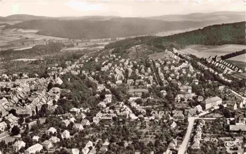 AK / Ansichtskarte Northeim Niedersachsen Vogelschau Stadtgebiet Huegel Felder Wohnhaeuser Kirche Strassennetz Wald