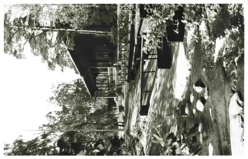 AK / Ansichtskarte Kotka Suomi Langinkoski Keisarillinen-kalastusmaja Bach Holzgebaeude Bruecke Wald Felsen