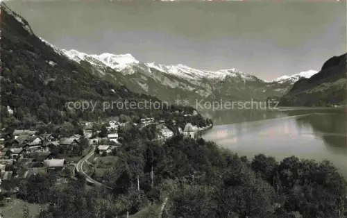 AK / Ansichtskarte Ringgenberg Brienzersee Interlaken BE Brienzersee See Dorf Rothornkette Berge Wald Haeuser