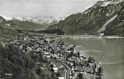 AK / Ansichtskarte Brienz Brienzersee BE See Dorf Berge Wald Kirche Bahnlinie Friedhof Vogelperspektive