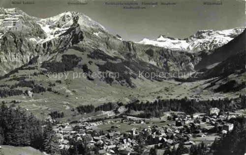 AK / Ansichtskarte Adelboden Frutigen BE Lohner Wildstrubel Grosslohner Steghorn Berge Schnee Wald Wiesen Dorf